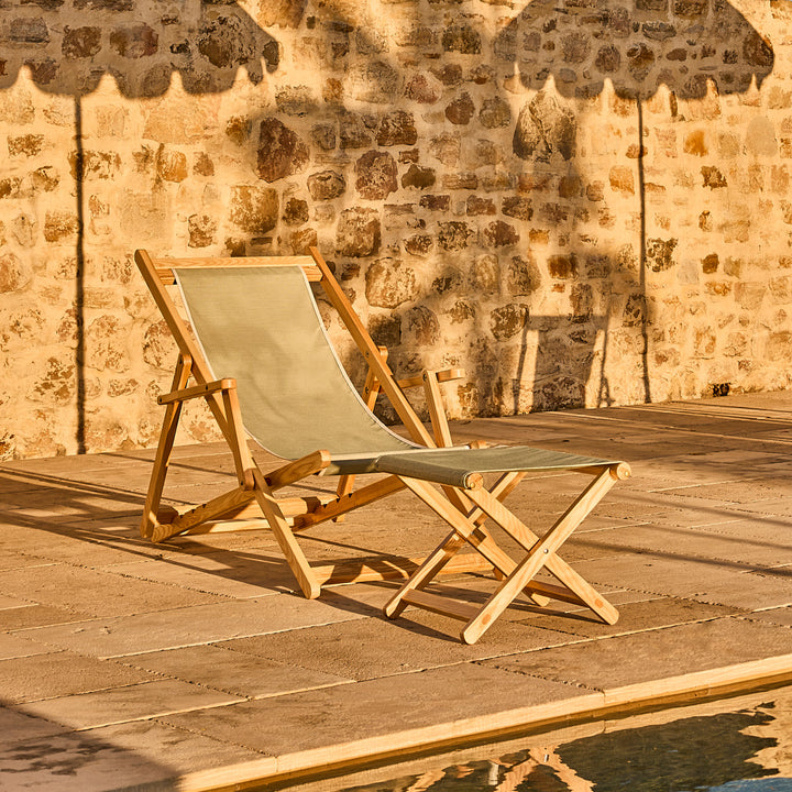Timber Deck chair and footstool by a pool with Alpine green fabric slings