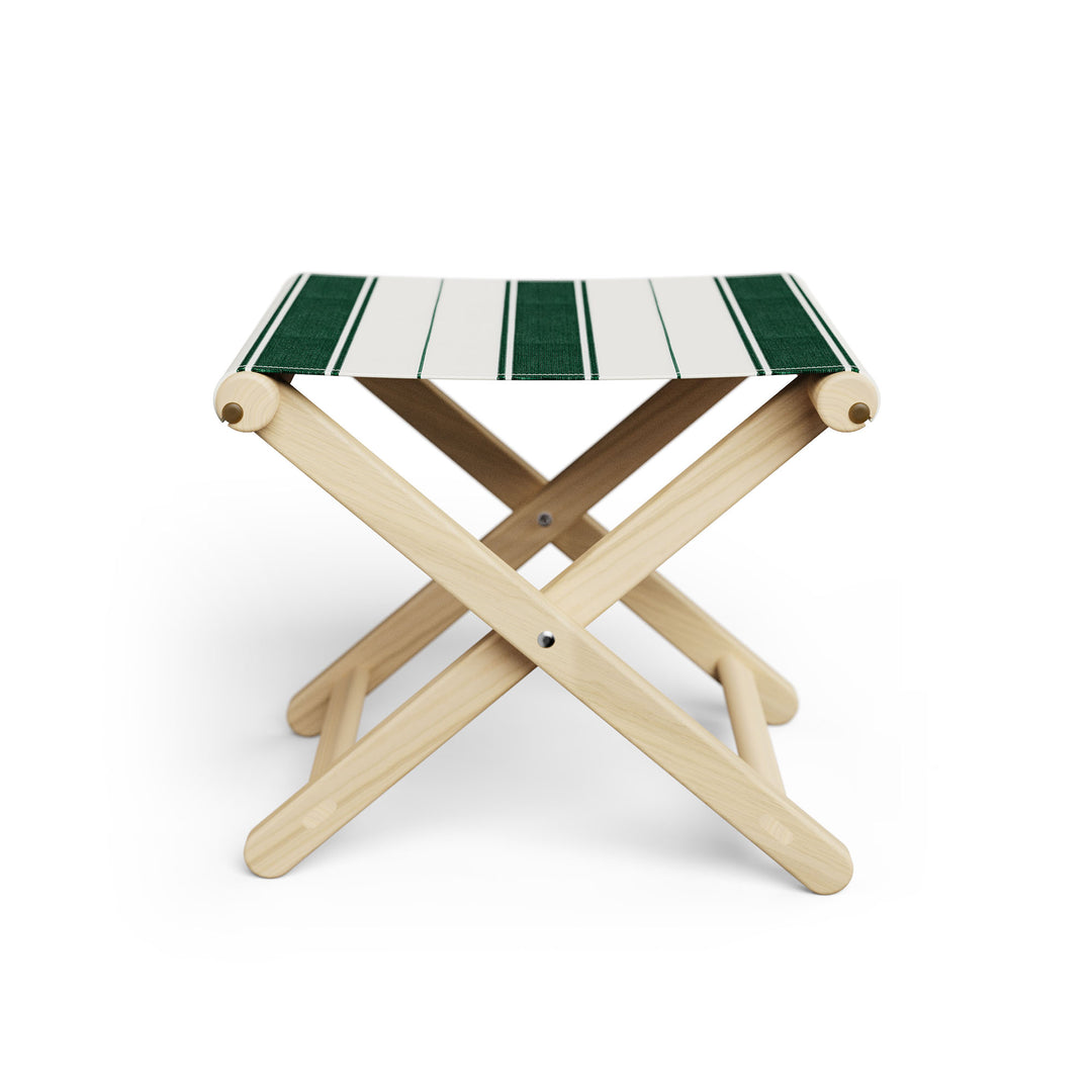 Basil Bangs Footstool, a portable outdoor footrest with a solid European Ash timber frame and outdoor acrylic fabric sling