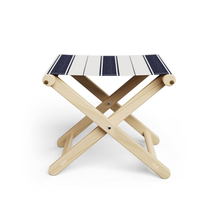 Basil Bangs Footstool, a portable outdoor footrest with a solid European Ash timber frame and outdoor acrylic fabric sling