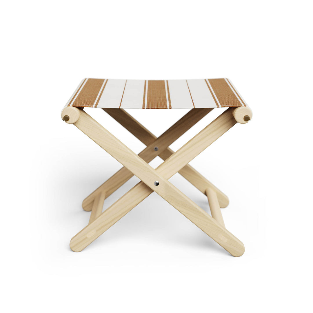 Basil Bangs Footstool, a portable outdoor footrest with a solid European Ash timber frame and outdoor acrylic fabric sling