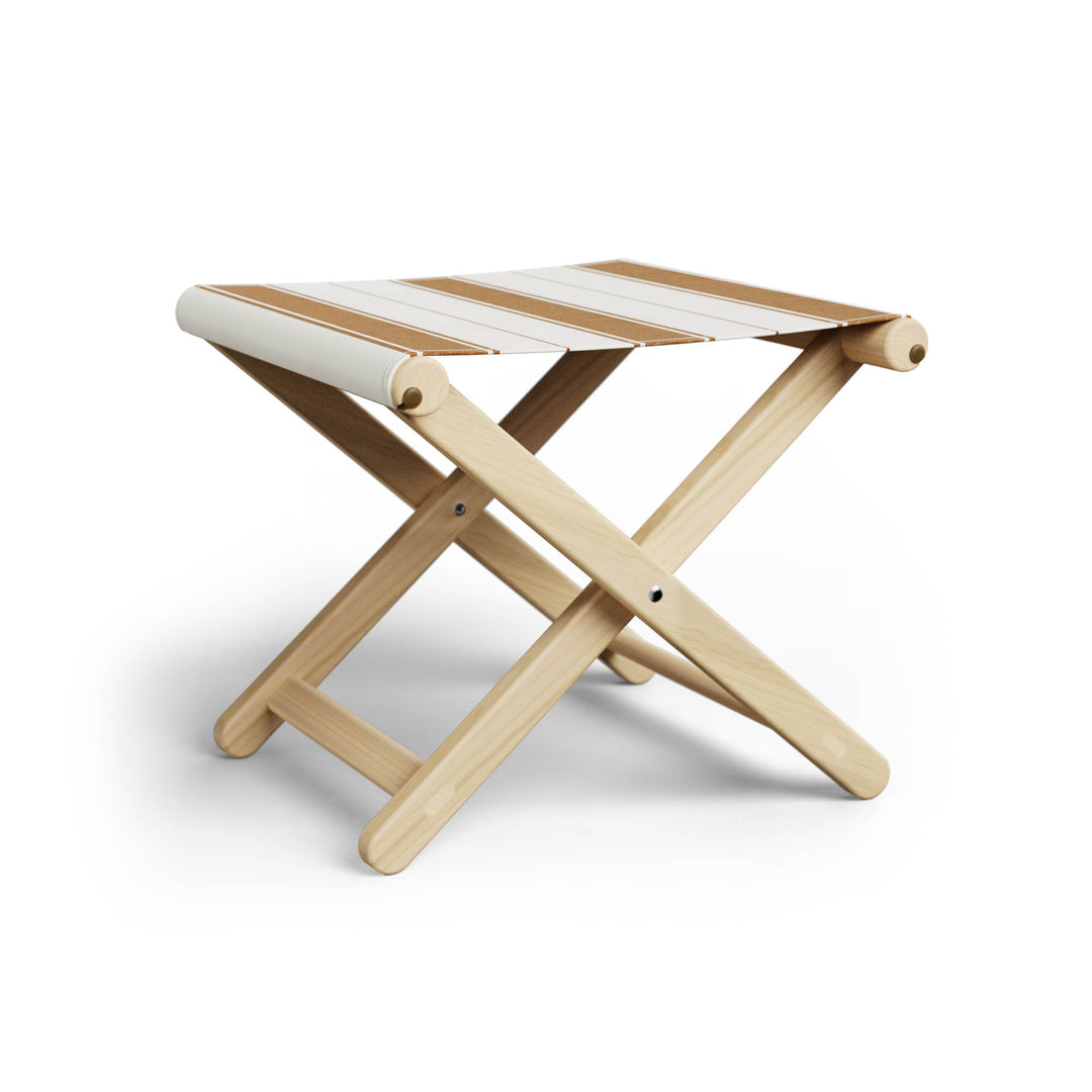 Basil Bangs Footstool, a portable outdoor footrest with a solid European Ash timber frame and outdoor acrylic fabric sling