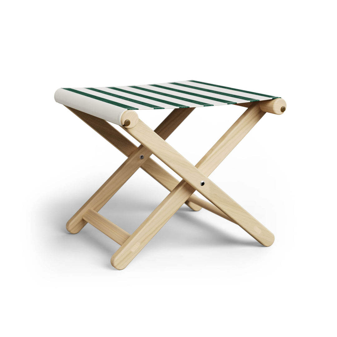 Basil Bangs Footstool, a portable outdoor footrest with a solid European Ash timber frame and outdoor acrylic fabric sling