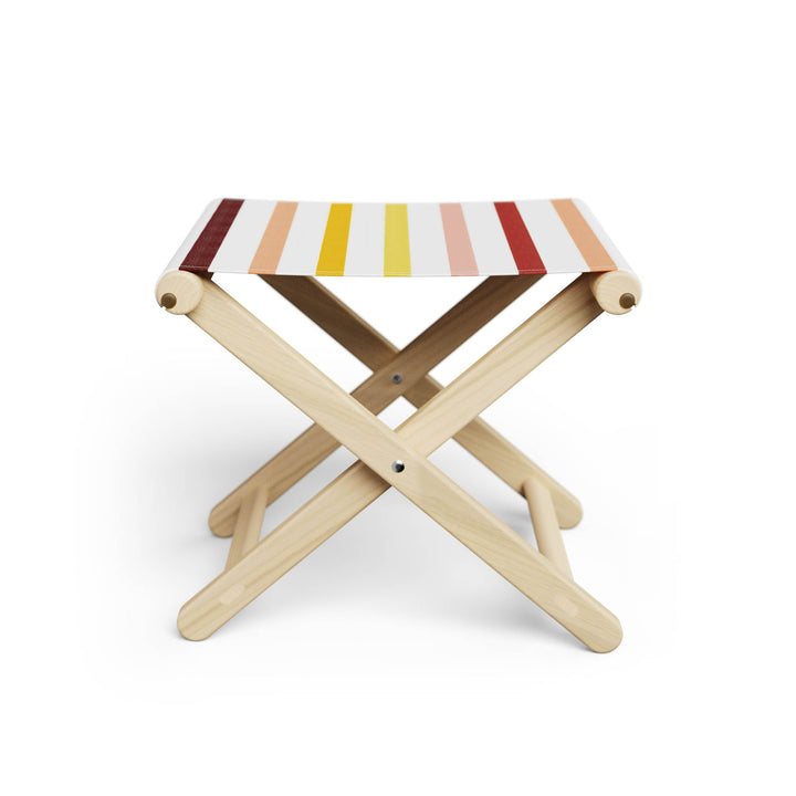 Basil Bangs Footstool, a portable outdoor footrest with a solid European Ash timber frame and outdoor acrylic fabric sling