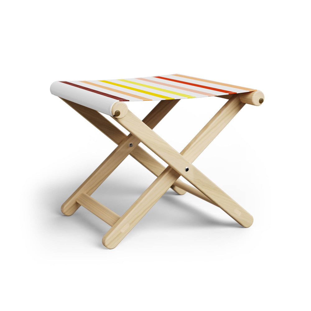 Basil Bangs Footstool, a portable outdoor footrest with a solid European Ash timber frame and outdoor acrylic fabric sling