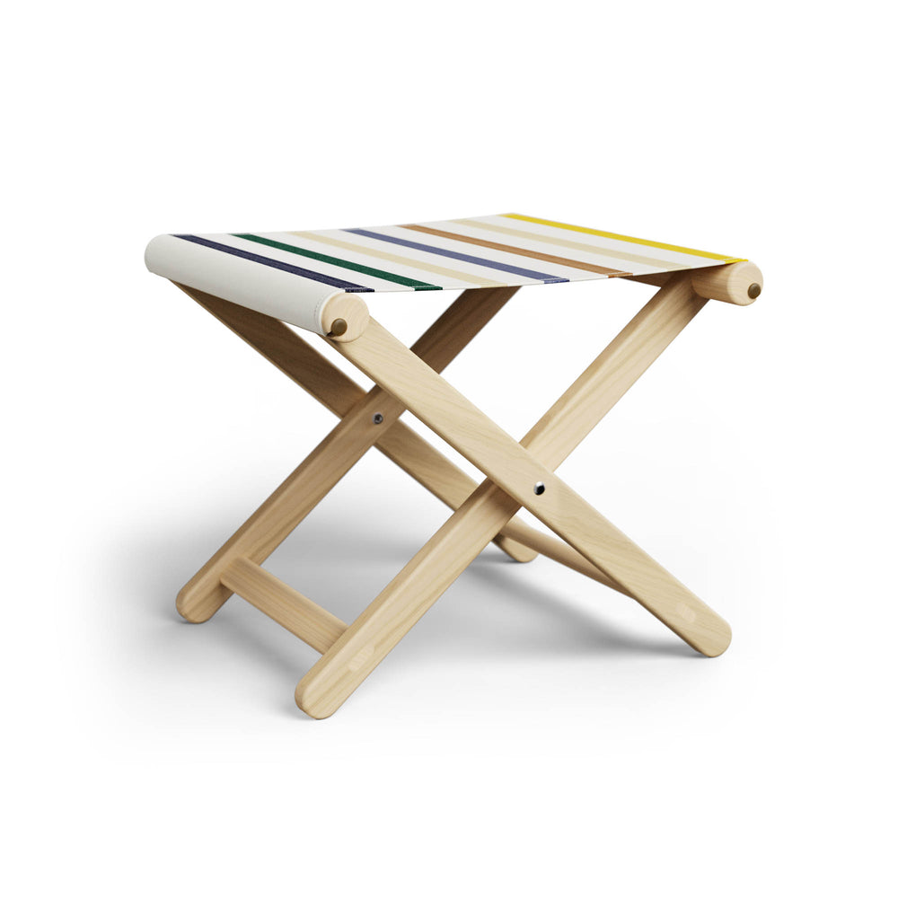 Basil Bangs Footstool, a portable outdoor footrest with a solid European Ash timber frame and outdoor acrylic fabric sling