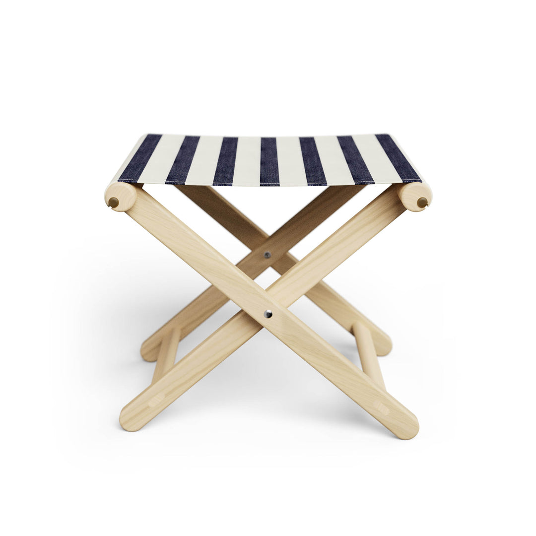 Basil Bangs Footstool, a portable outdoor footrest with a solid European Ash timber frame and outdoor acrylic fabric sling