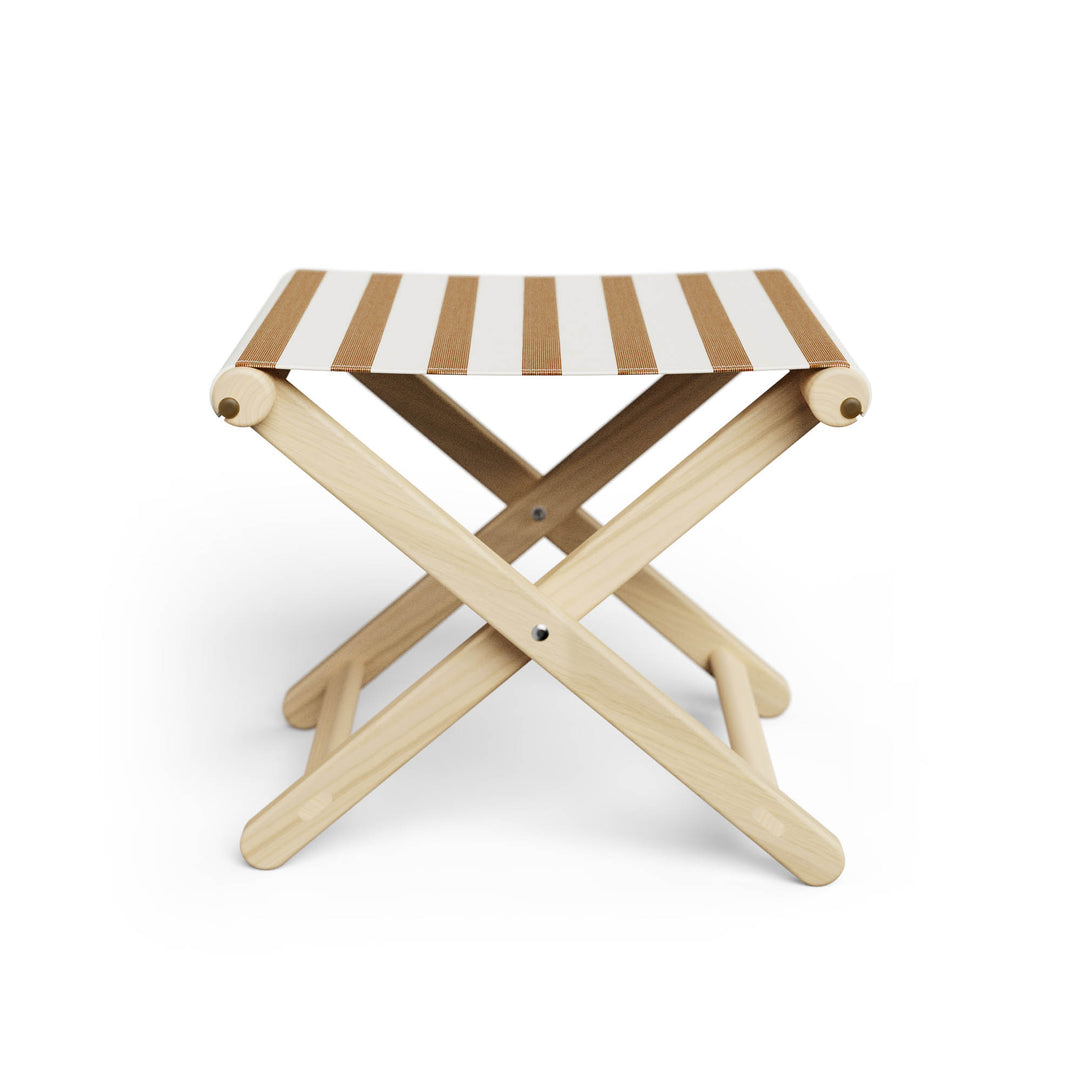 Basil Bangs Footstool, a portable outdoor footrest with a solid European Ash timber frame and outdoor acrylic fabric sling