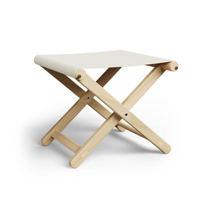 Basil Bangs Footstool, a portable outdoor footrest with a solid European Ash timber frame and outdoor acrylic fabric sling