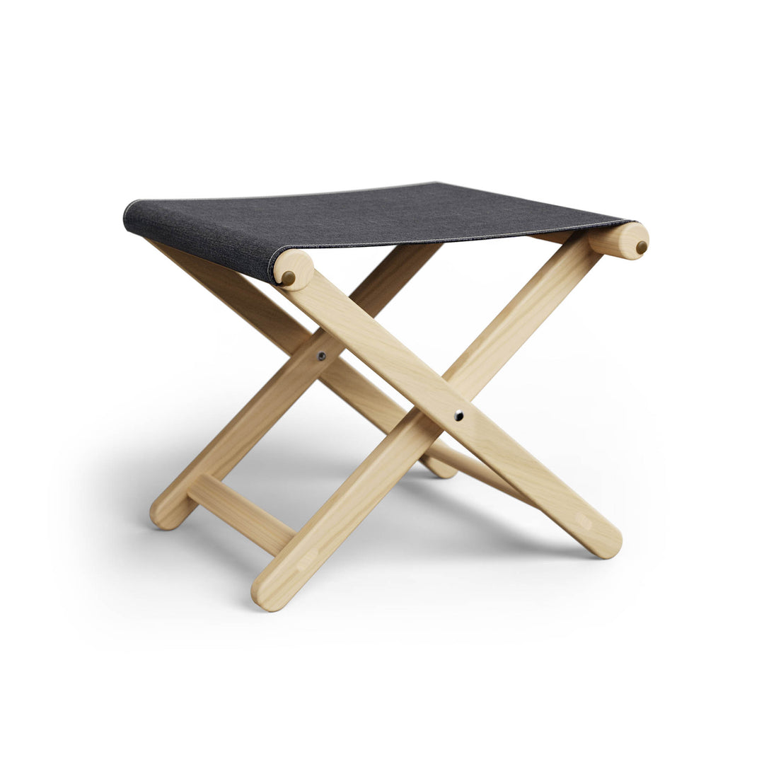 Basil Bangs Footstool, a portable outdoor footrest with a solid European Ash timber frame and outdoor acrylic fabric sling