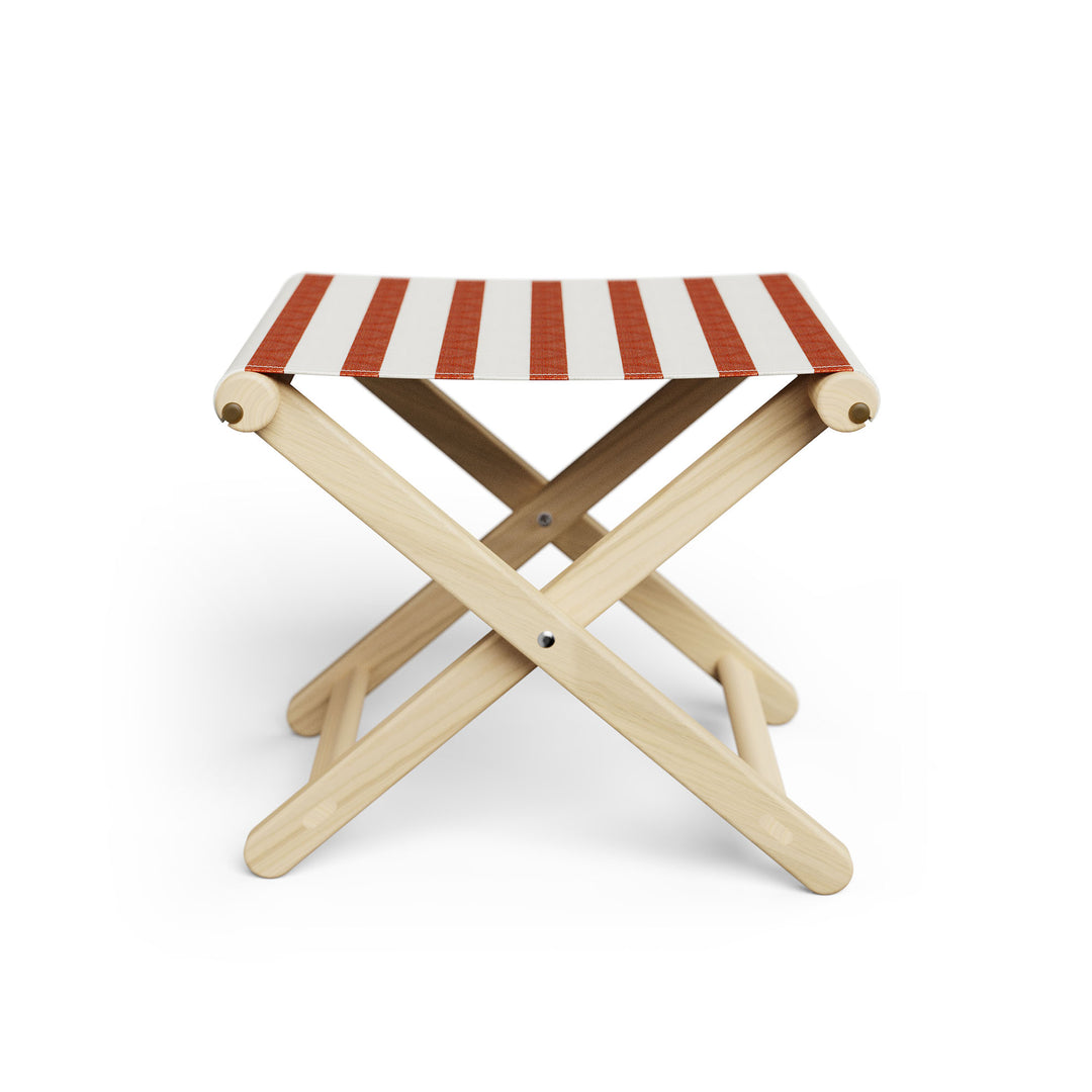 Basil Bangs Footstool, a portable outdoor footrest with a solid European Ash timber frame and outdoor acrylic fabric sling