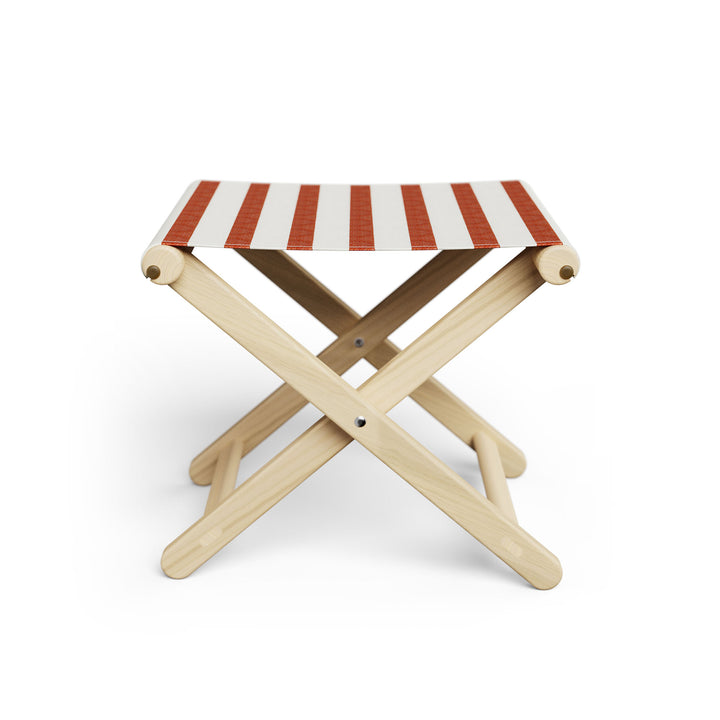 Basil Bangs Footstool, a portable outdoor footrest with a solid European Ash timber frame and outdoor acrylic fabric sling