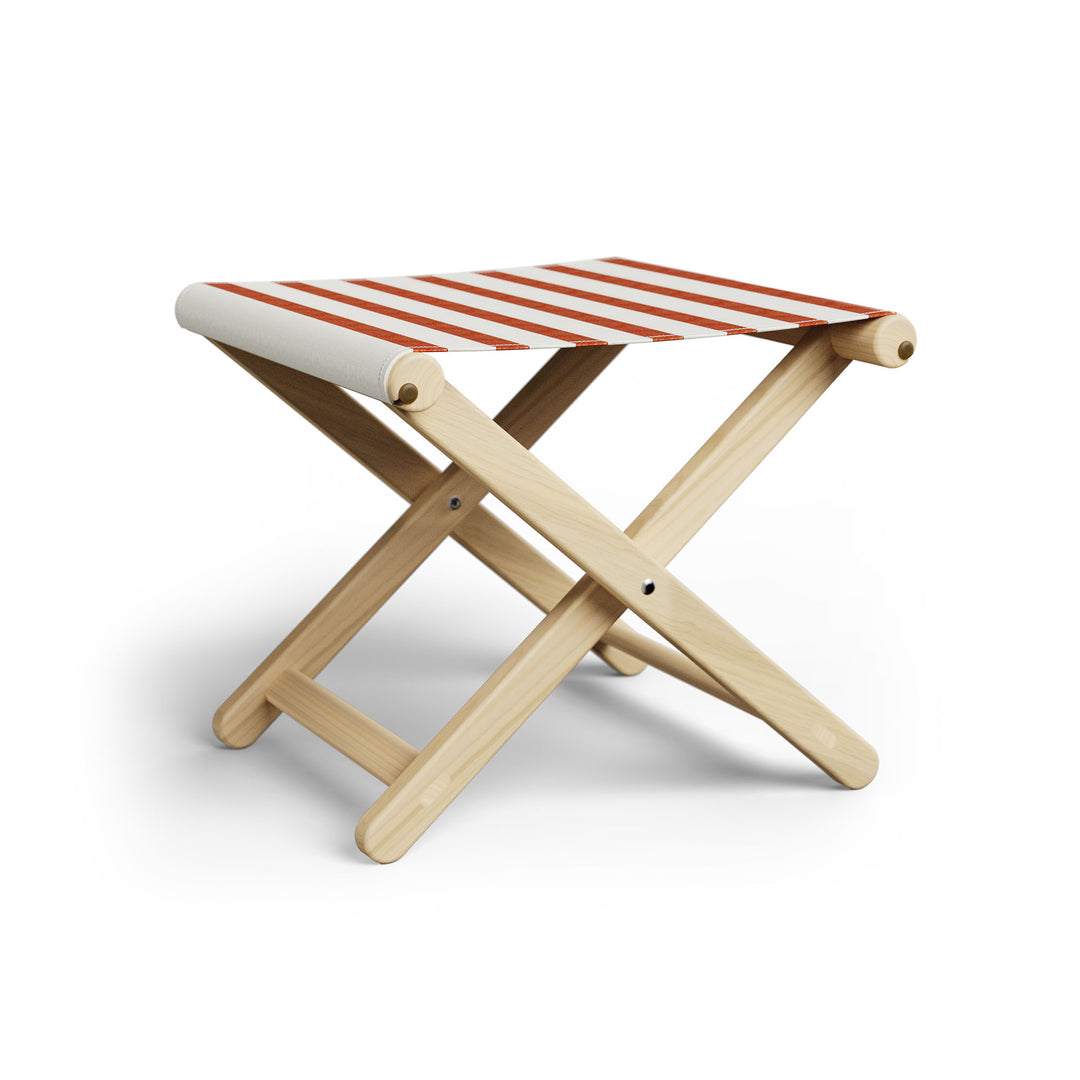 Basil Bangs Footstool, a portable outdoor footrest with a solid European Ash timber frame and outdoor acrylic fabric sling