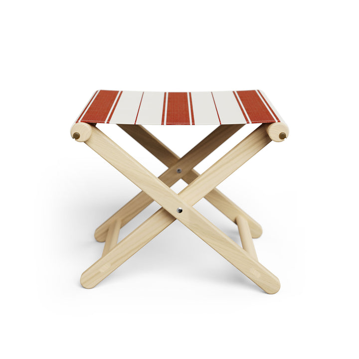 Basil Bangs Footstool, a portable outdoor footrest with a solid European Ash timber frame and outdoor acrylic fabric sling