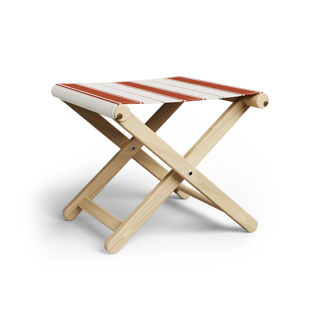 Basil Bangs Footstool, a portable outdoor footrest with a solid European Ash timber frame and outdoor acrylic fabric sling