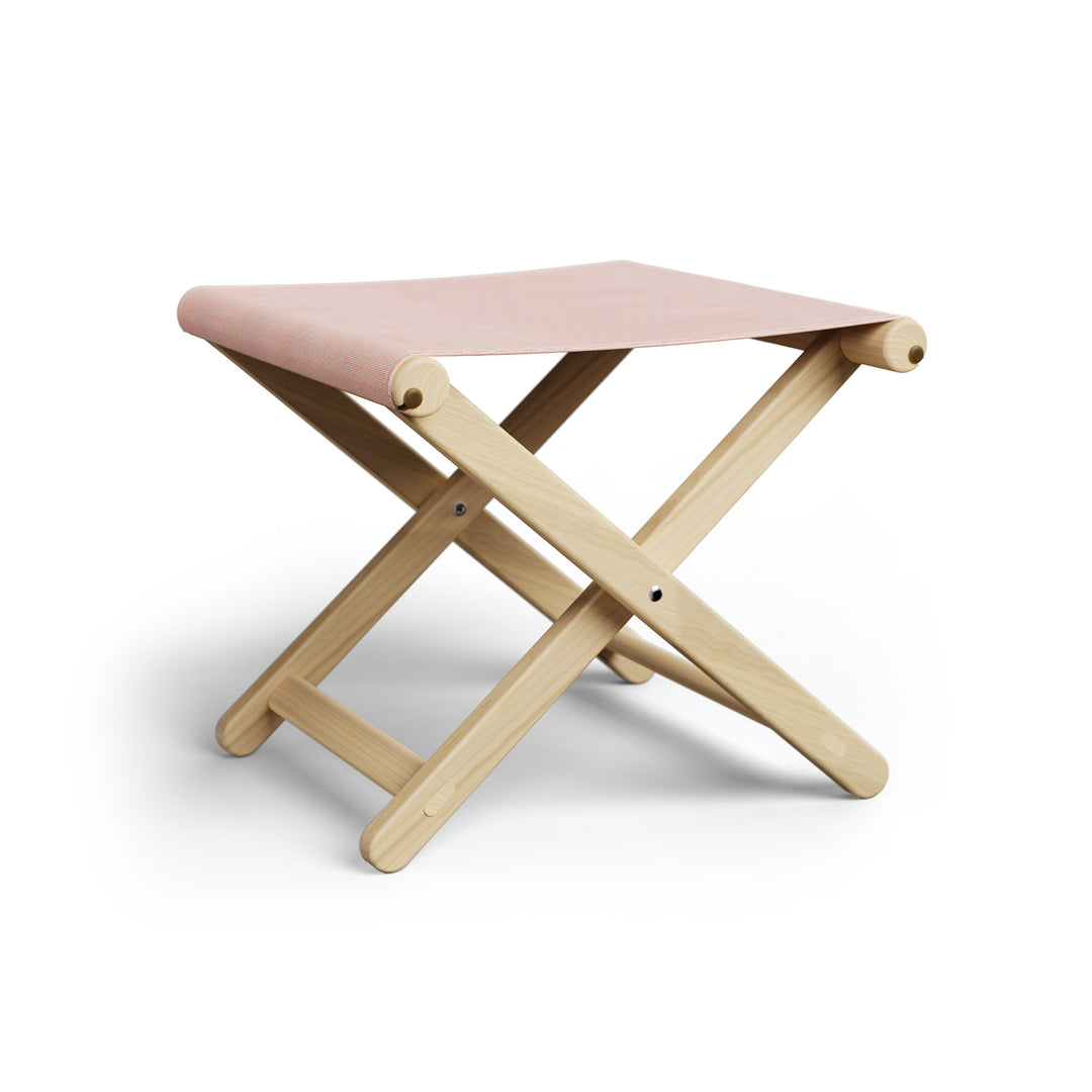 Basil Bangs Footstool, a portable outdoor footrest with a solid European Ash timber frame and outdoor acrylic fabric sling