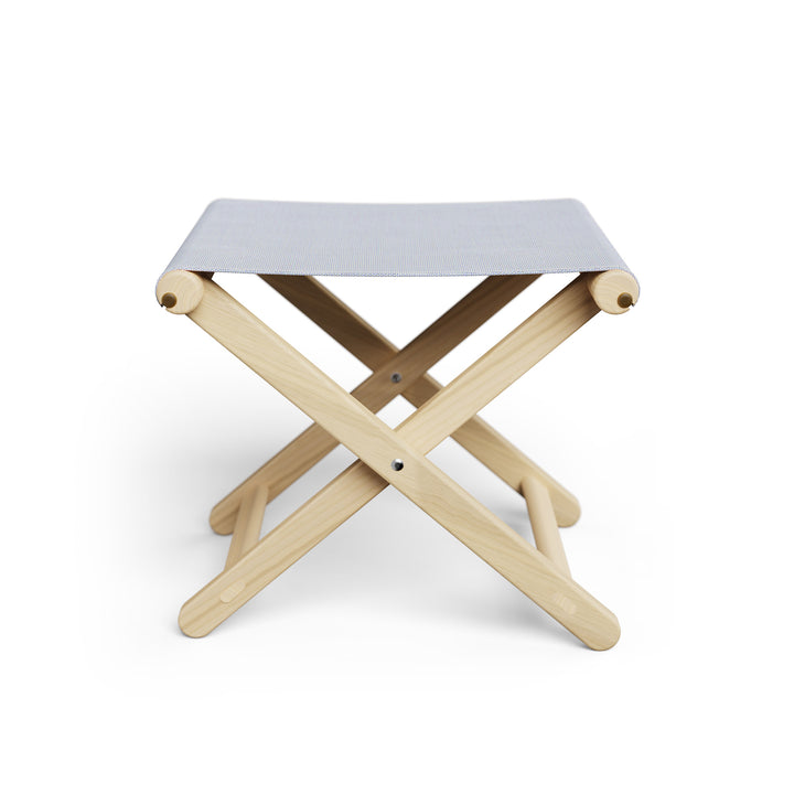 Basil Bangs Footstool, a portable outdoor footrest with a solid European Ash timber frame and outdoor acrylic fabric sling