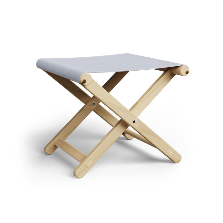 Basil Bangs Footstool, a portable outdoor footrest with a solid European Ash timber frame and outdoor acrylic fabric sling
