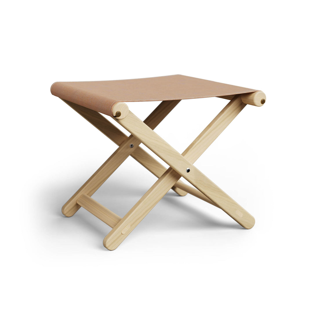 Basil Bangs Footstool, a portable outdoor footrest with a solid European Ash timber frame and outdoor acrylic fabric sling