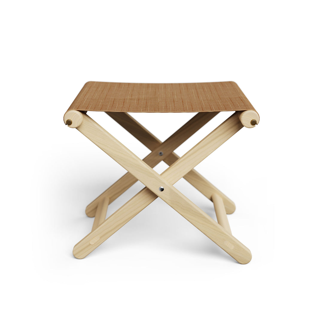 Basil Bangs Footstool, a portable outdoor footrest with a solid European Ash timber frame and outdoor acrylic fabric sling
