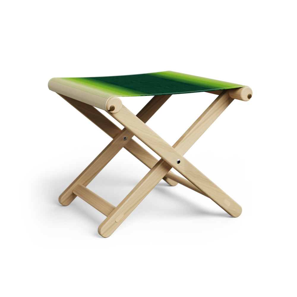 Basil Bangs Footstool, a portable outdoor footrest with a solid European Ash timber frame and outdoor acrylic fabric sling
