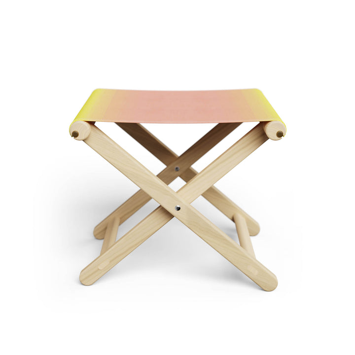 Basil Bangs Footstool, a portable outdoor footrest with a solid European Ash timber frame and outdoor acrylic fabric sling