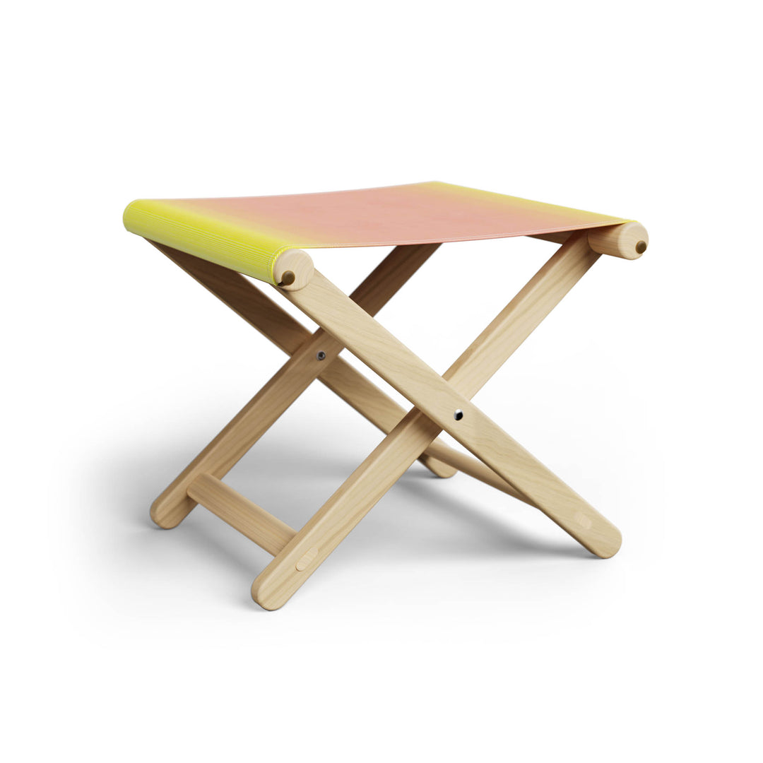 Basil Bangs Footstool, a portable outdoor footrest with a solid European Ash timber frame and outdoor acrylic fabric sling