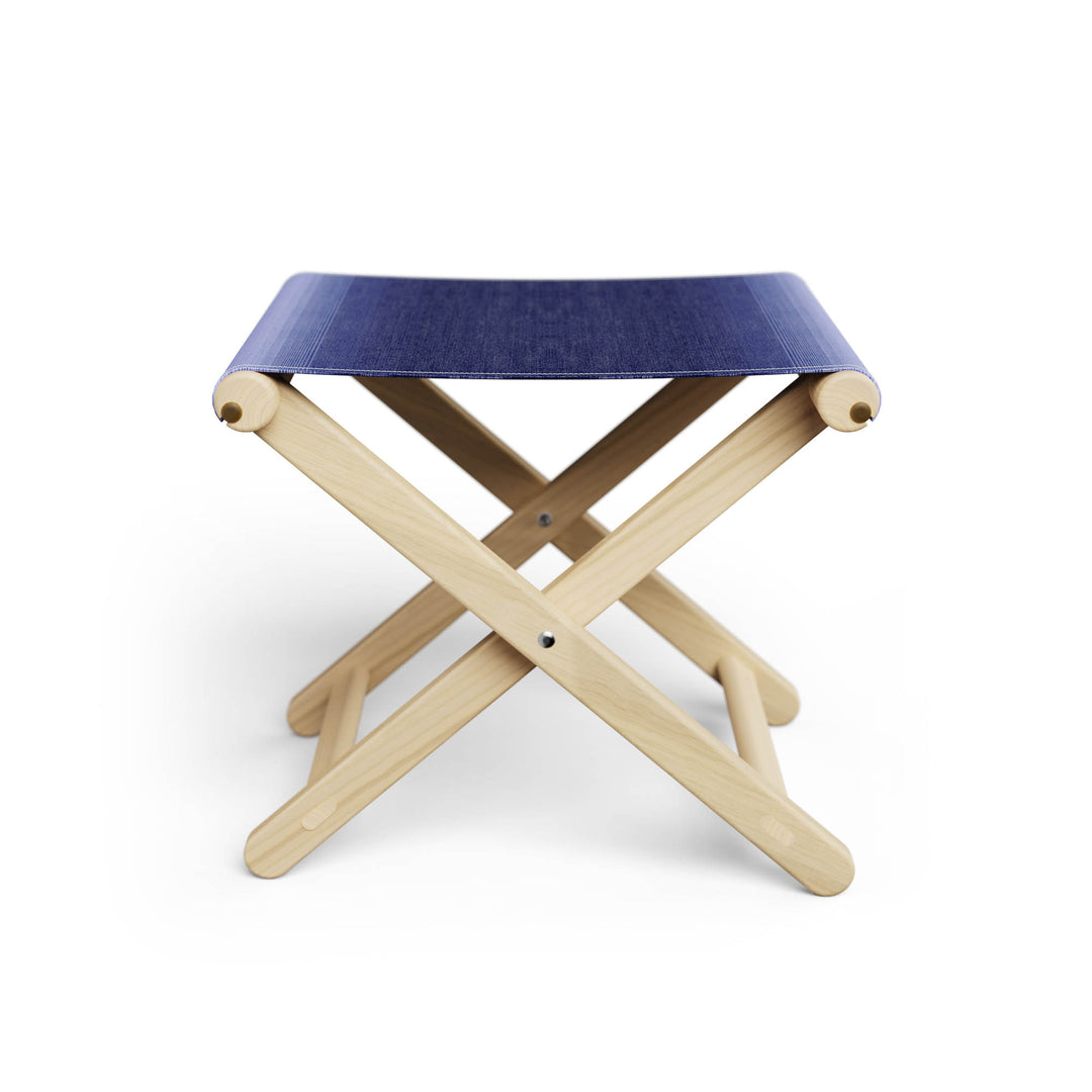 Basil Bangs Footstool, a portable outdoor footrest with a solid European Ash timber frame and outdoor acrylic fabric sling