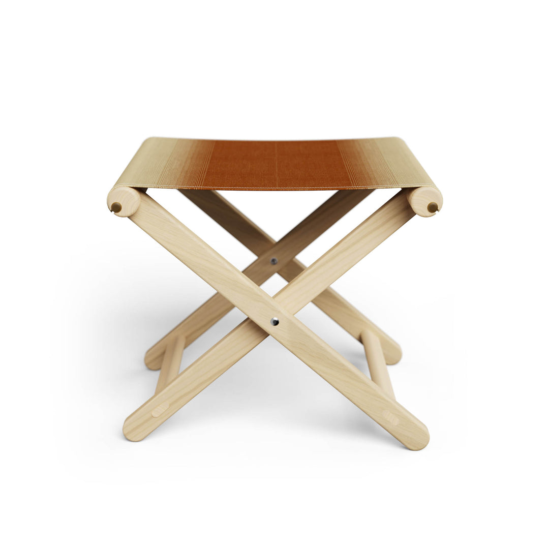 Basil Bangs Footstool, a portable outdoor footrest with a solid European Ash timber frame and outdoor acrylic fabric sling