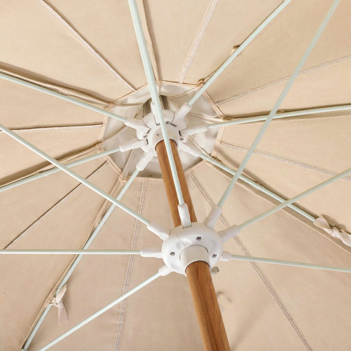 Basil Bangs Pagoda 2.1m commercial patio umbrella internal frame detail showing woodgrain powder-coated centre pole and fibreglass ribs