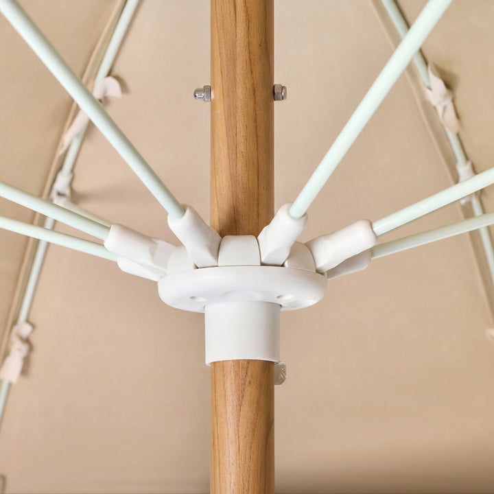 Basil Bangs Pagoda 2.1m commercial patio umbrella internal frame detail showing woodgrain powder-coated centre pole and fibreglass ribs