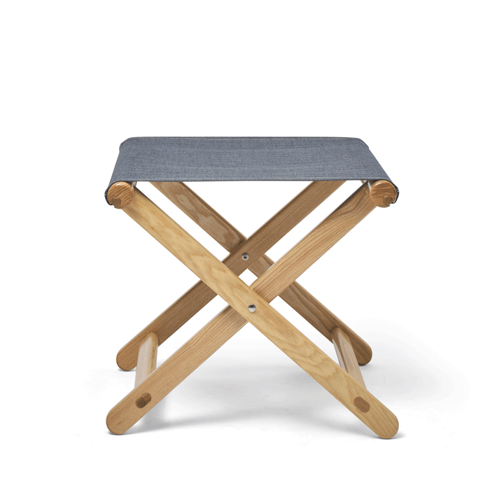 Basil Bangs Footstool folding animation. A portable outdoor footrest with a solid European Ash timber frame and outdoor acrylic fabric sling.