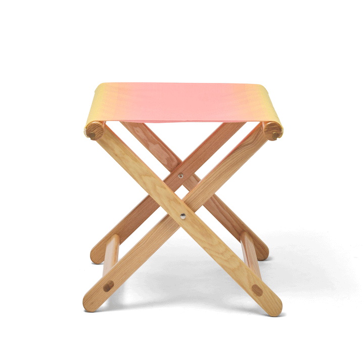 Basil Bangs Footstool folding animation. A portable outdoor footrest with a solid European Ash timber frame and outdoor acrylic fabric sling.