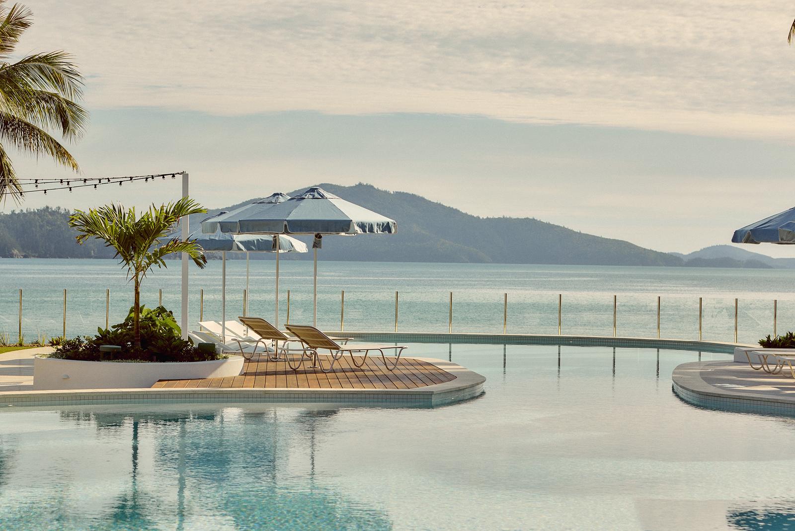 The Sails Pool Hamilton Island with Basil Bangs Blue Sundial Umbrella