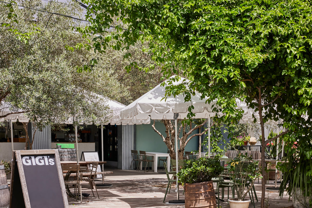 Basil Bangs commercial patio umbrella in white keyhole valance at howard smith wharves