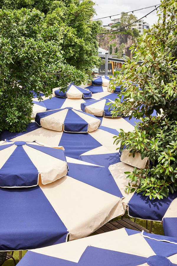 Detail of Basil Bangs Patio umbrellas at Howard Smith Wharves Navy and Beige Double Caspar