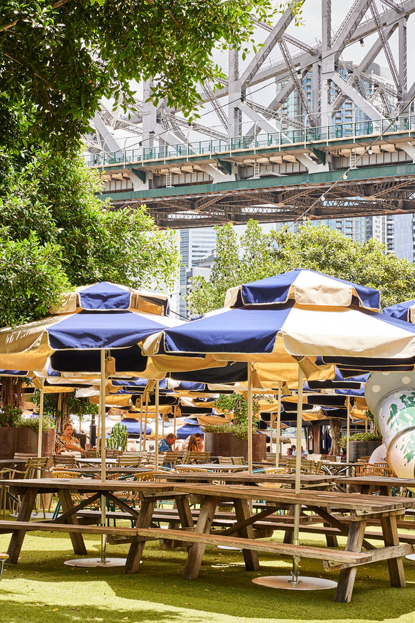Full image of Navy and Beige Basil Bangs Commercial umbrellas at Howard Smith Wharves beergarden