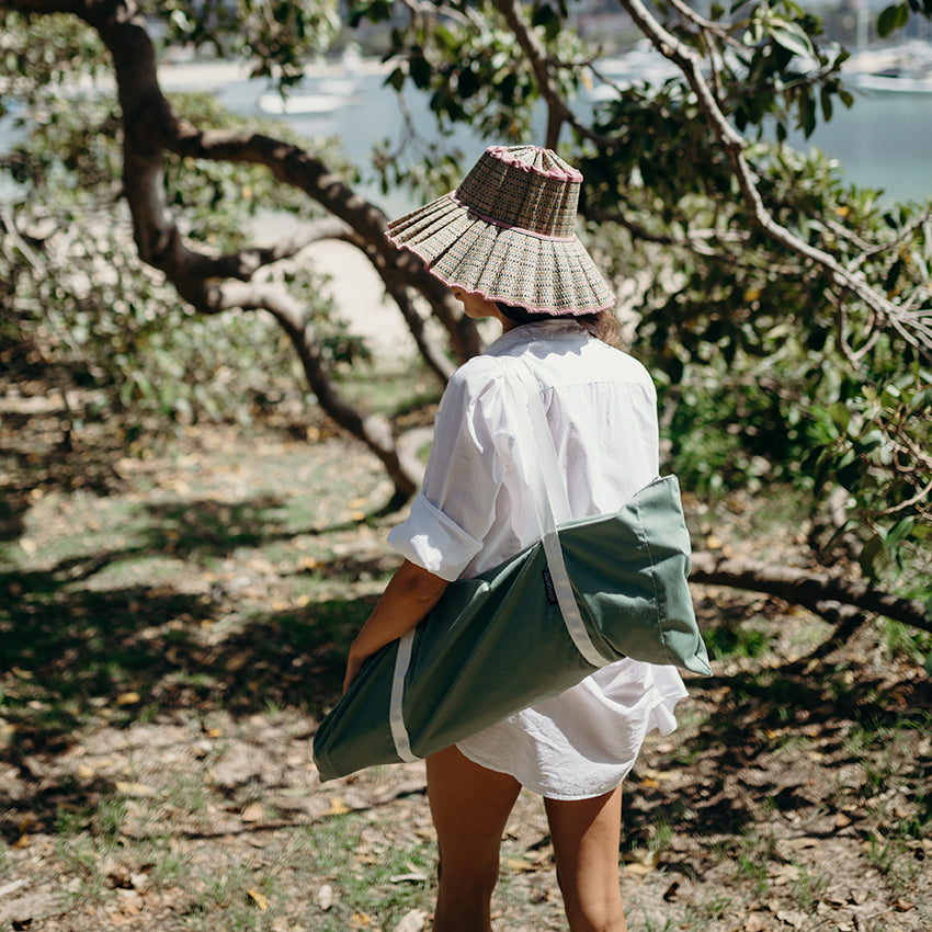 Compact portable beach tent packed into lightweight carry bag